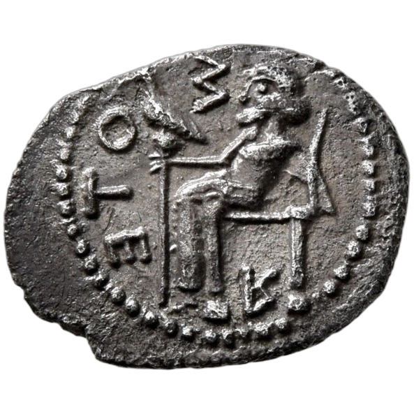 Zeus Soter seated left on low throne, holding scepter surmounted by an eagle in his right hand.
