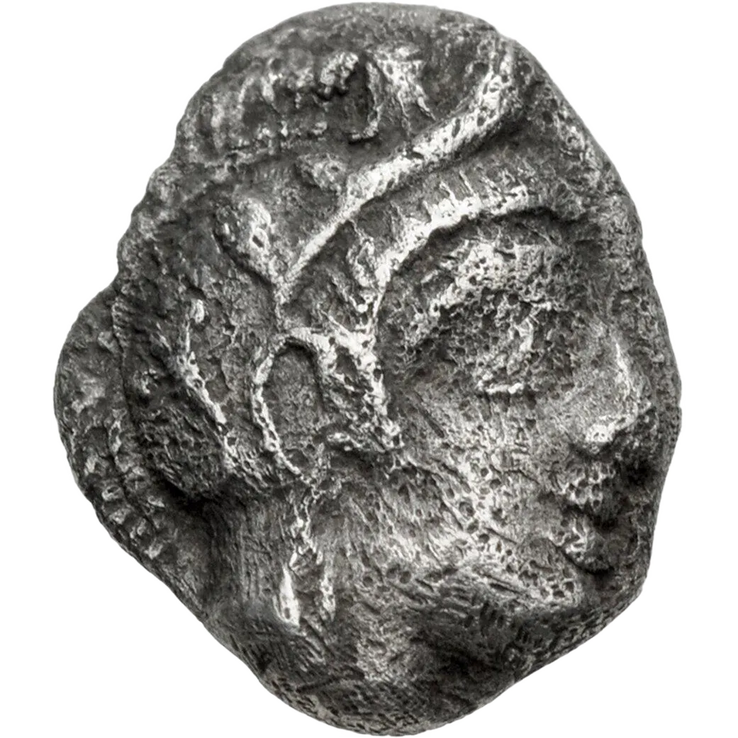 Head of Athena right, wearing crested Attic helmet decorated with three olive leaves and palmette.