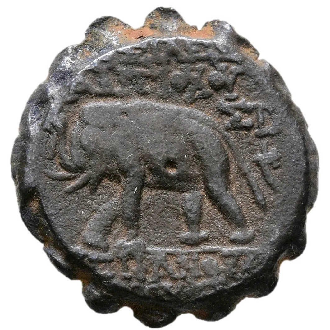 Elephant walking left, holding torch in trunk; to right, ΣTA above cornucopia