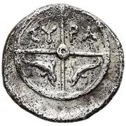 Wheel of four spokes; ΣY-PA in the upper quarters and a pair of opposed dolphins in the lower.