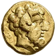 Bearded head of Zeus Ammon to right, with ram's horn over his ear; API left