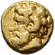 Bearded head of Zeus Ammon to left, with ram's horn over his ear; XAI Right