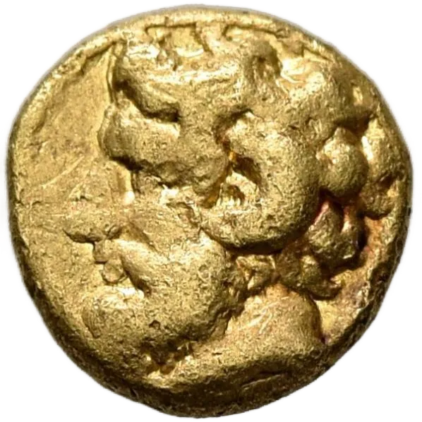 Bearded head of Zeus Ammon to left, with ram's horn over his ear; XAI Right
