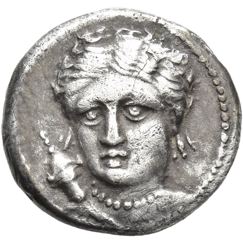 Facing head of Artemis turned slightly to left, wearing quiver, triple-pendant earring and beaded necklace